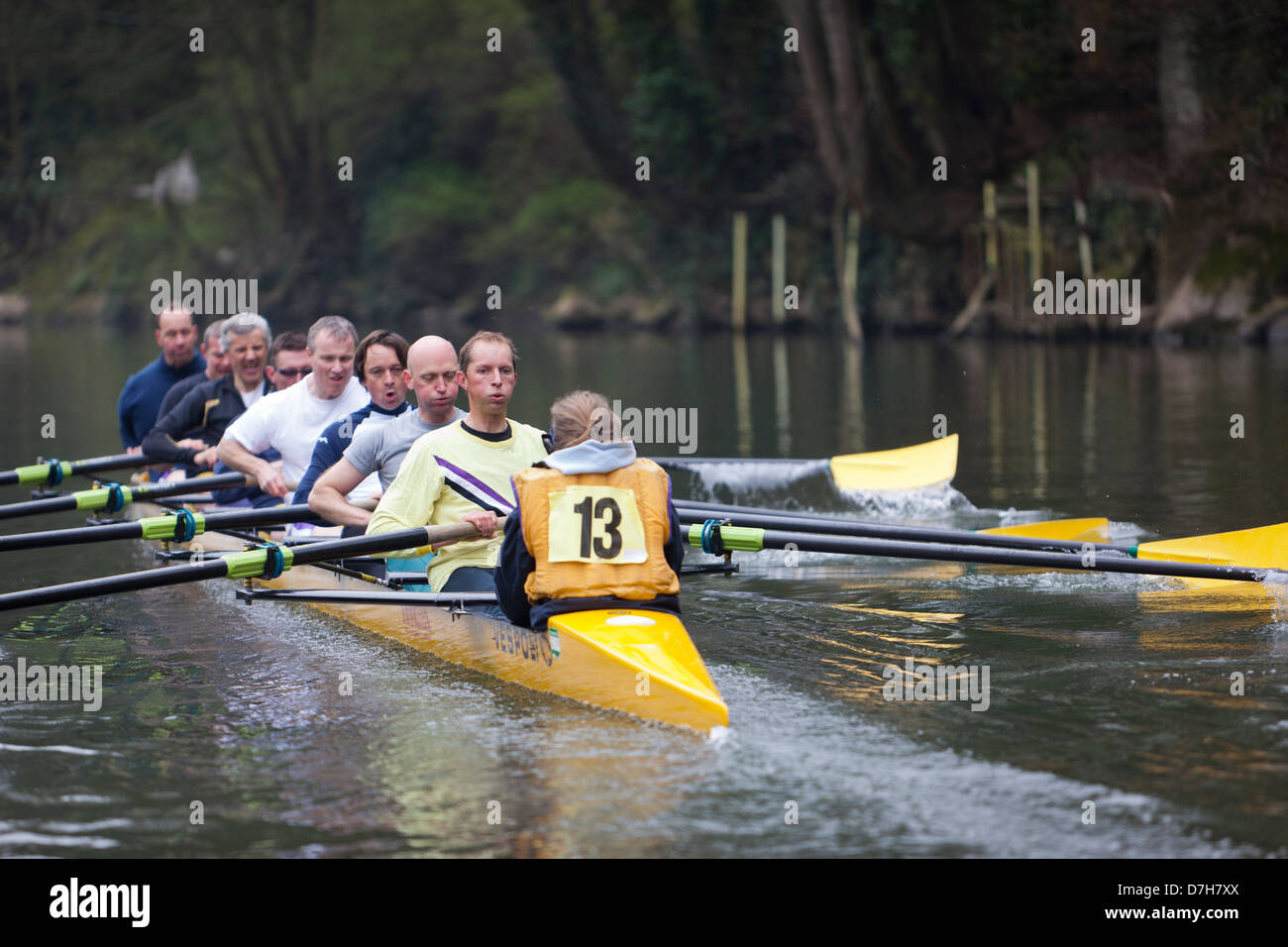 Bath, United Kingdom - March 27, 2011: Members of an amateur sports club row an 8 man sweep boat on the River Avon. Stock Photo
