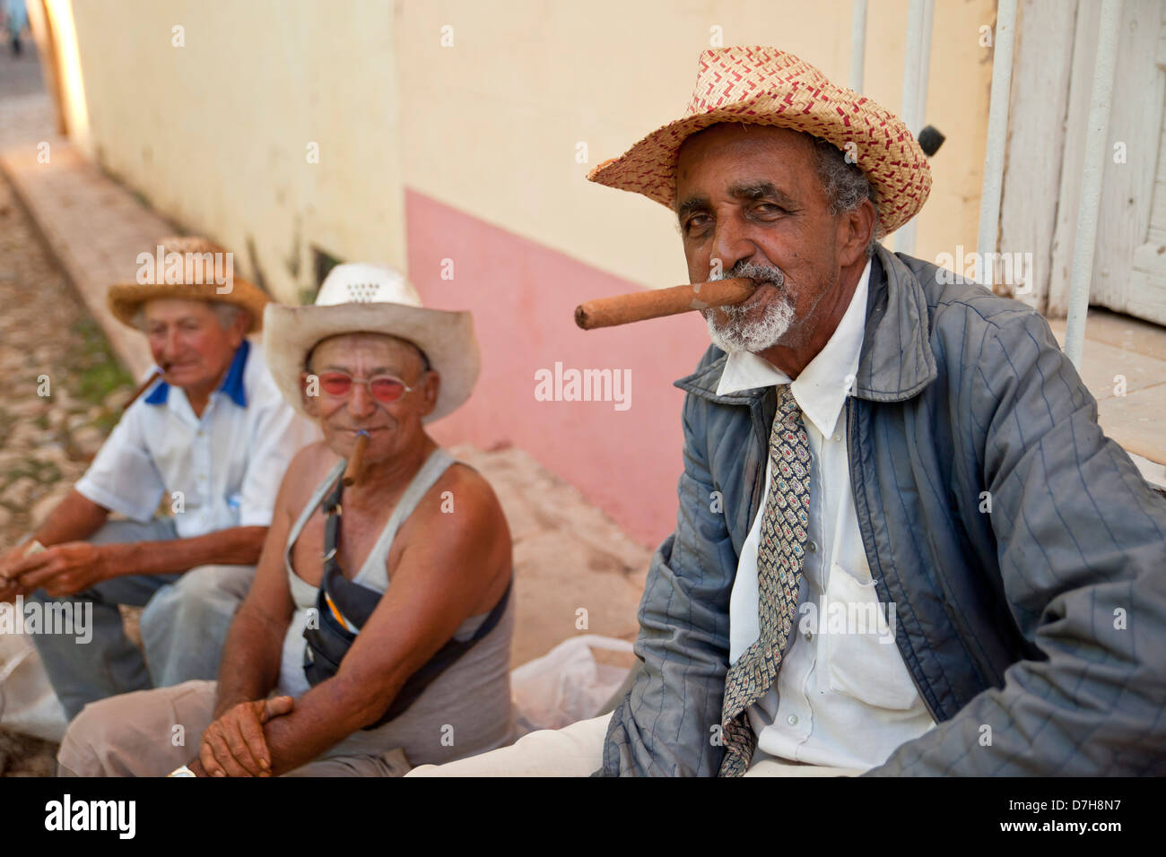 elderly man smoking cigars, Trinidad, Cuba, Caribbean Stock Photo