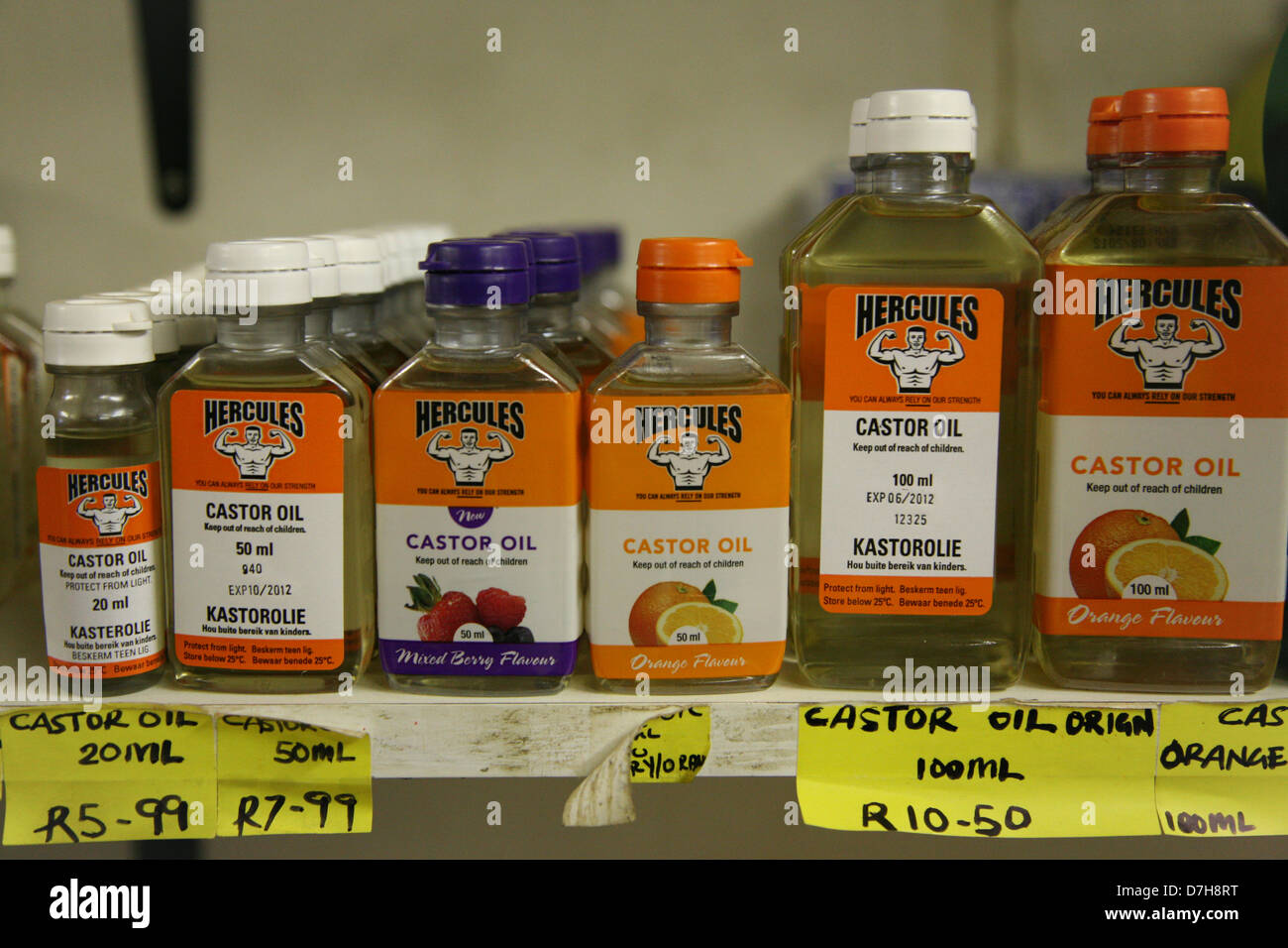Bottles flavoured caster oil on a shelf Stock Photo