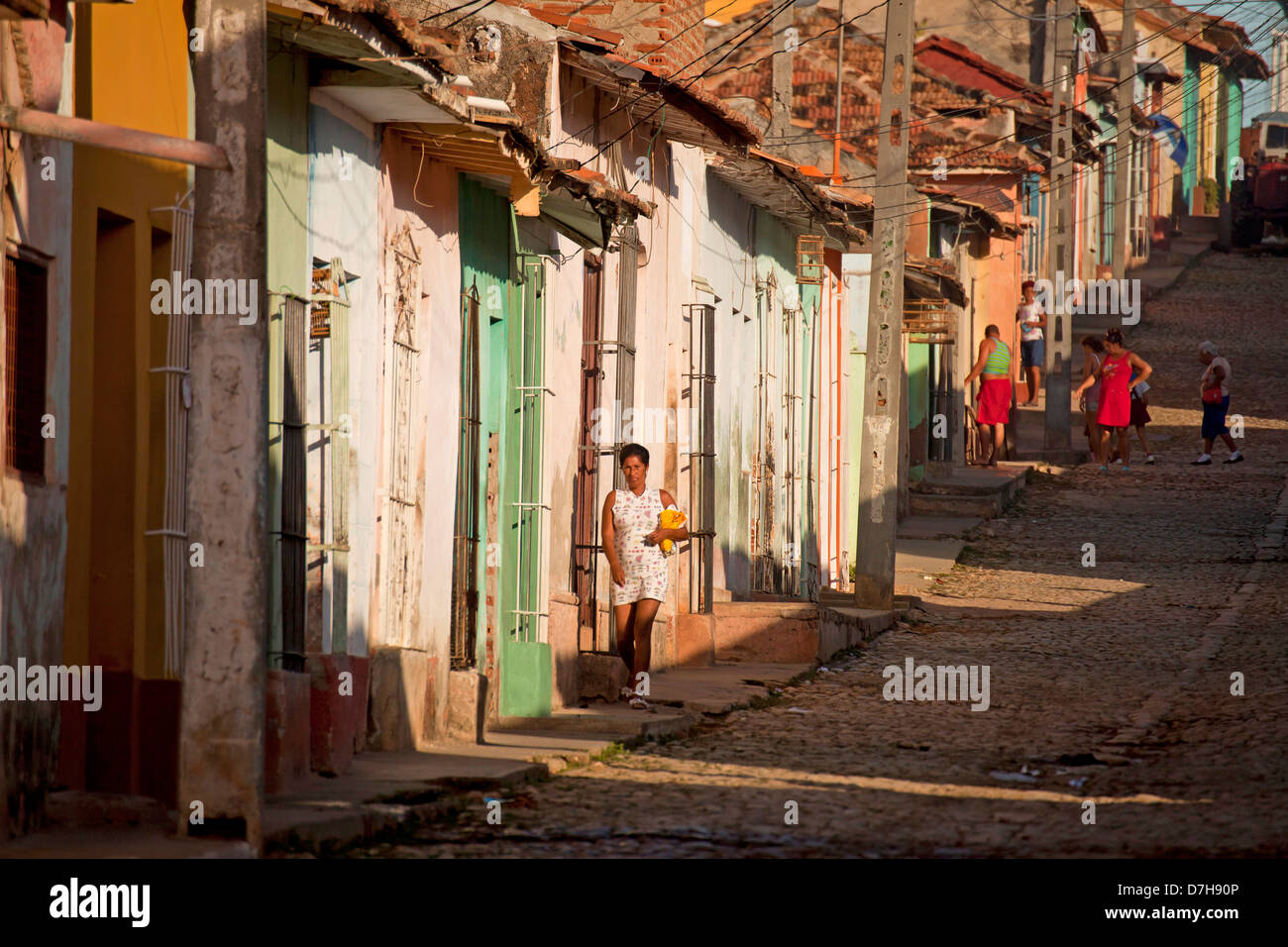 typical cobblestone street with colourful homes in the old town of Trinidad, Cuba, Caribbean Stock Photo