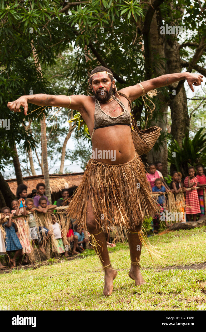 Lowering the tone, a male dancer wearing a bra, performs during the annual festival of traditional culture in the Banks Islands, northern Vanuatu Stock Photo