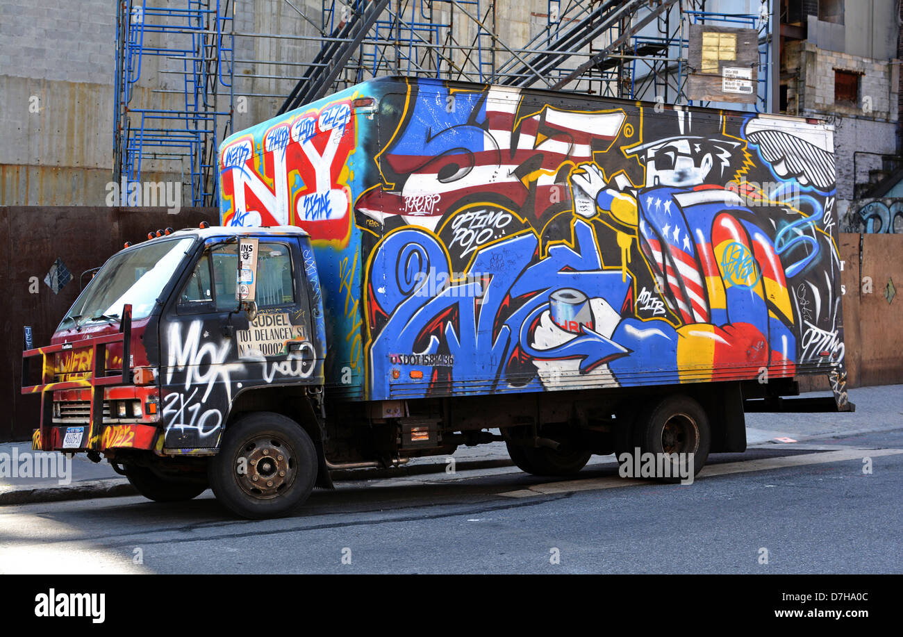 A truck with painted graffiti parked on Lafayette Street in the East Village, New York City Stock Photo