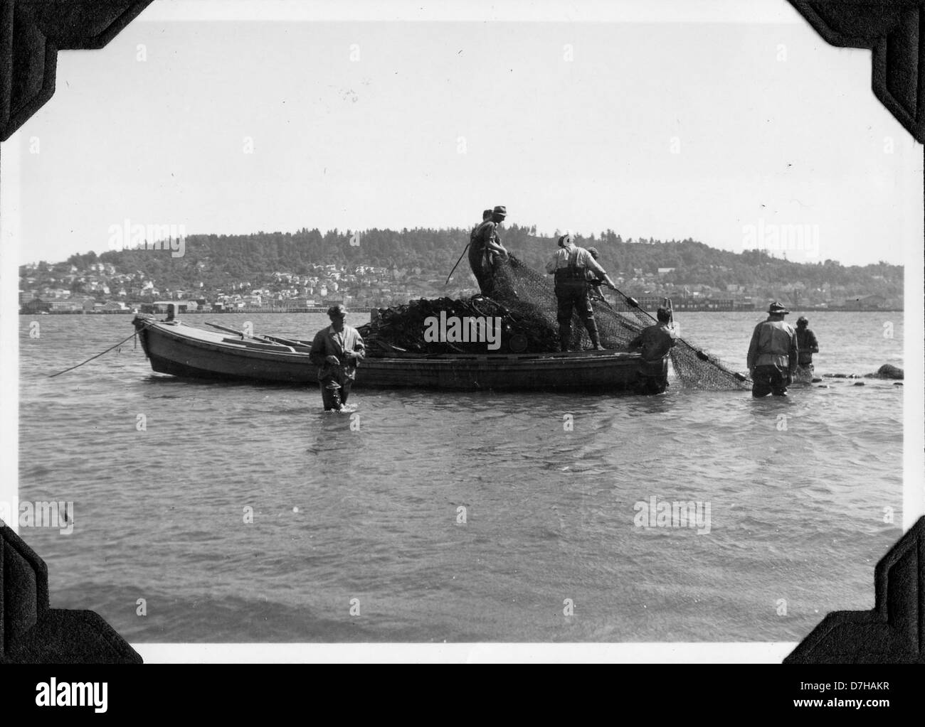This image shows the process of loading a seine net onto a skiff for ...