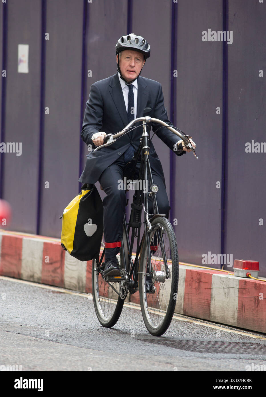 Businessman weird bicycle unusual handlebars Stock Photo