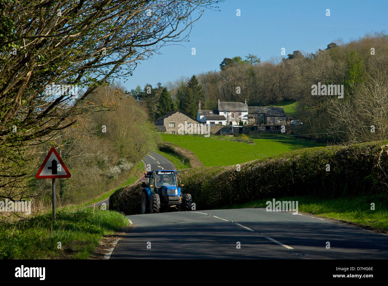 Tractor on the A5074 road through the Lyth Valley, South Lakeland, Cumbria, England UK Stock Photo