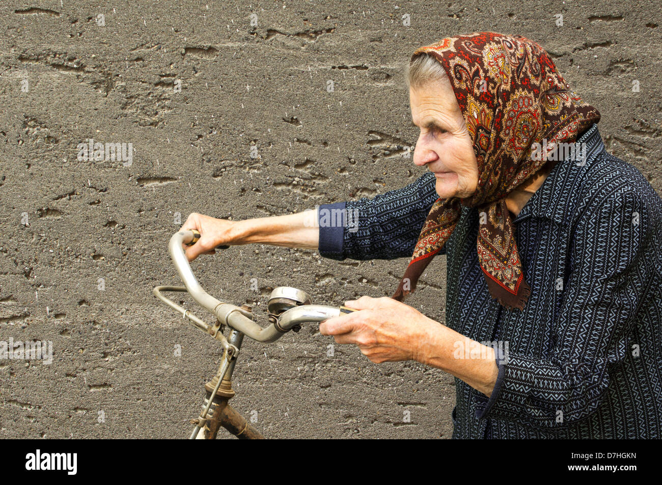 Active elderly woman with her bike. Stock Photo