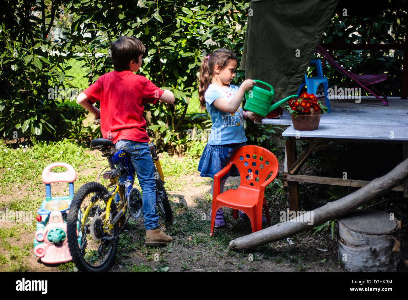 children playing in the garden Stock Photo - Alamy