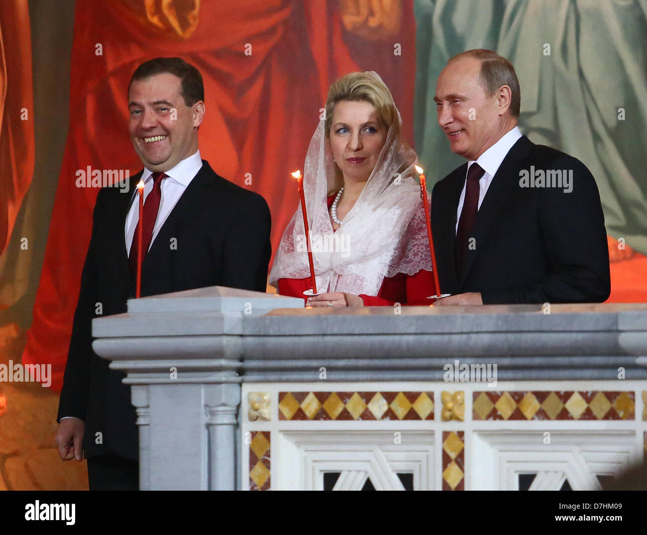 May 5, 2013 - Moscow, Russia - May 05,2013. Pictured: l-r Russia's Prime Minister Dmitry Medvedev, Medvedev's spouse Svetlana Medvedeva and Russia's President Vladimir Putin attend Orthodox Easter church service in the Christ the Savior Cathedral of Moscow. (Credit Image: © PhotoXpress/ZUMAPRESS.com) Stock Photo