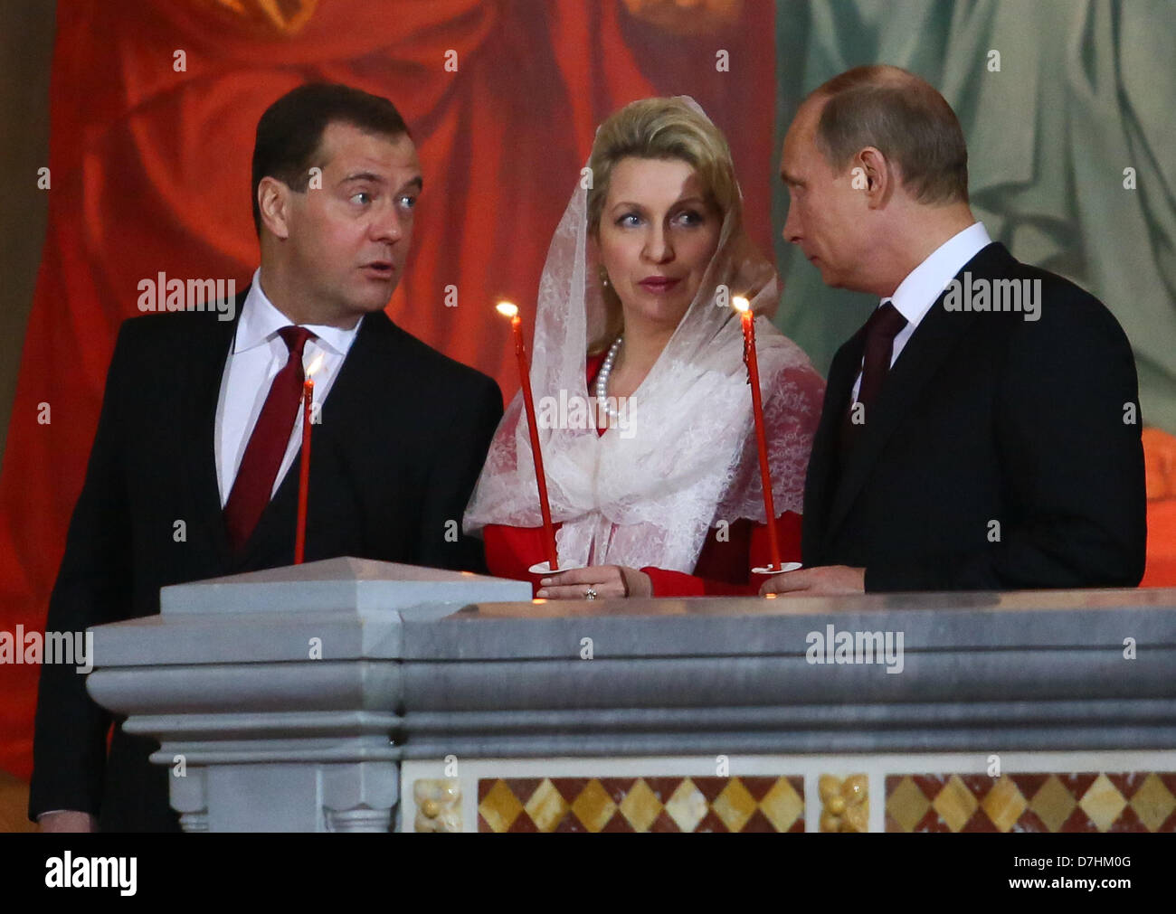 May 5, 2013 - Moscow, Russia - May 05,2013. Pictured: l-r Russia's Prime Minister Dmitry Medvedev, Medvedev's spouse Svetlana Medvedeva and Russia's President Vladimir Putin attend Orthodox Easter church service in the Christ the Savior Cathedral of Moscow. (Credit Image: © PhotoXpress/ZUMAPRESS.com) Stock Photo