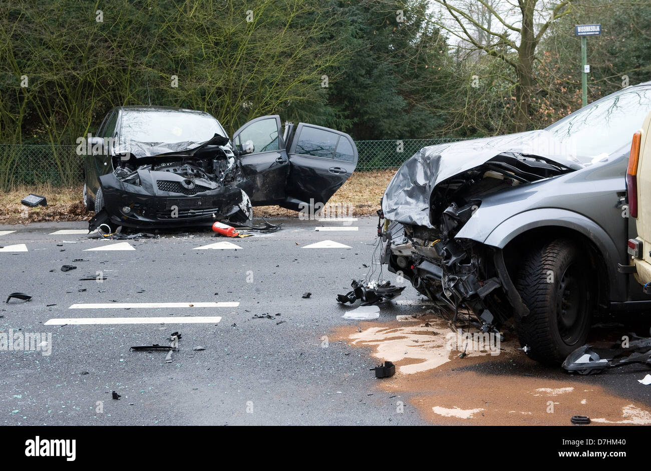 Two cars who crashed into another car on a interstate road Stock Photo