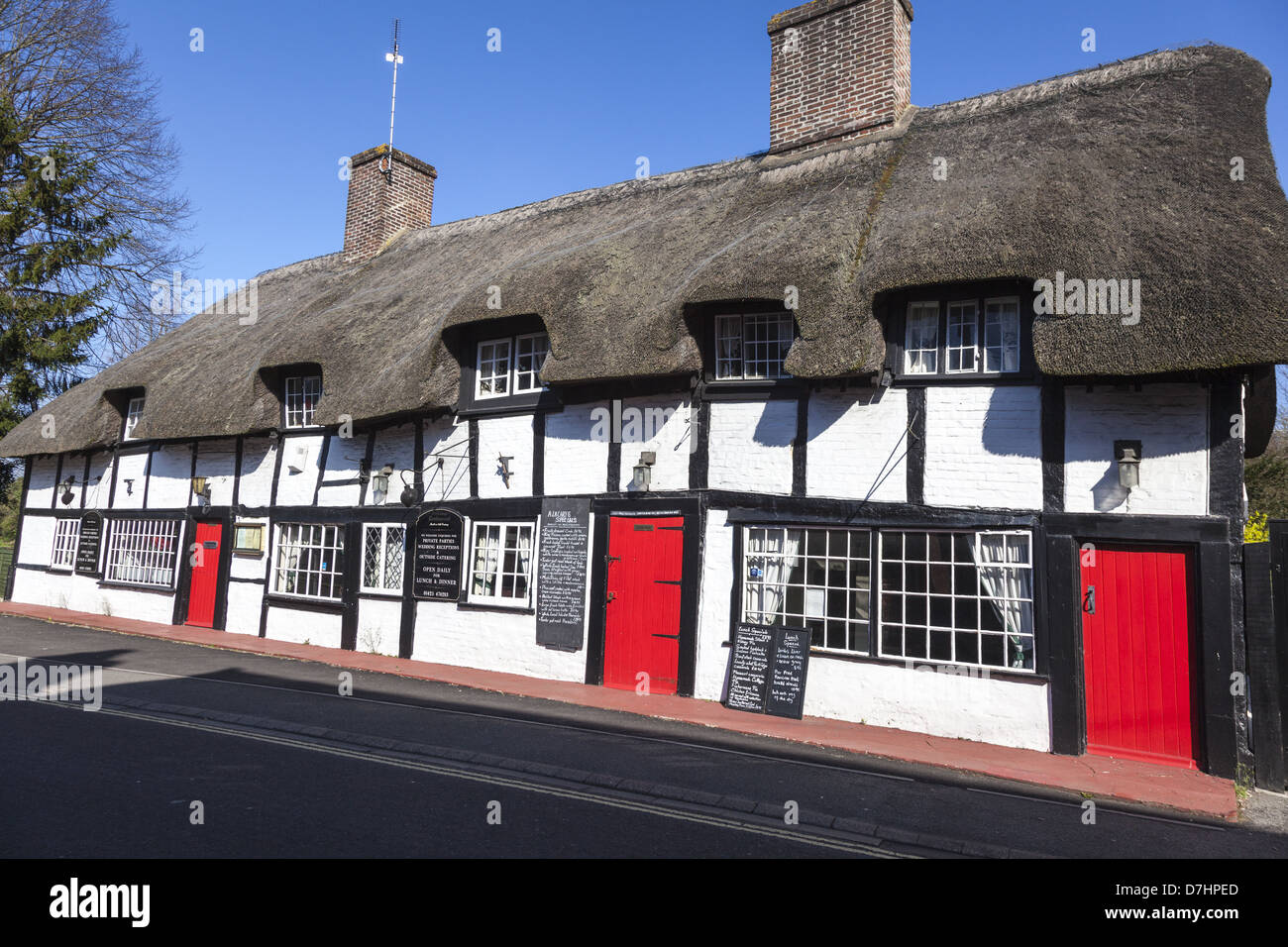 Thatched timbered building, now a restaurant Ringwood Hampshire England thought to have been built around the 14th century Stock Photo