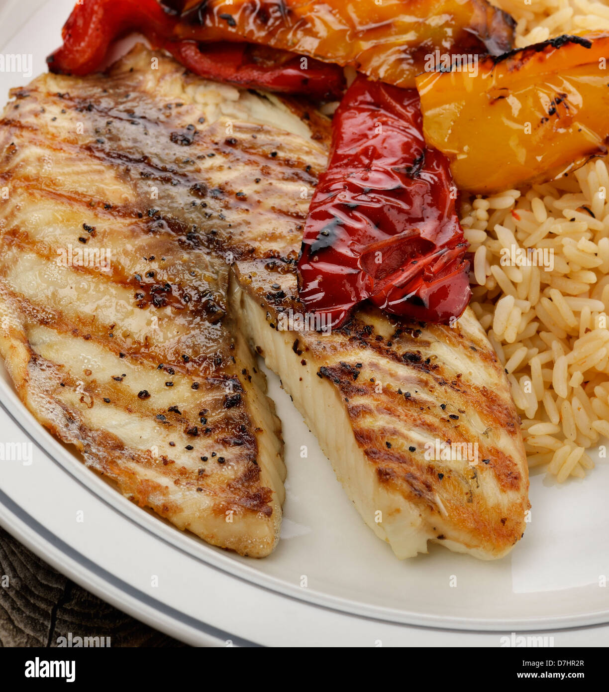 Grilled Tilapia Fillet With Rice And Vegetables Stock Photo Alamy