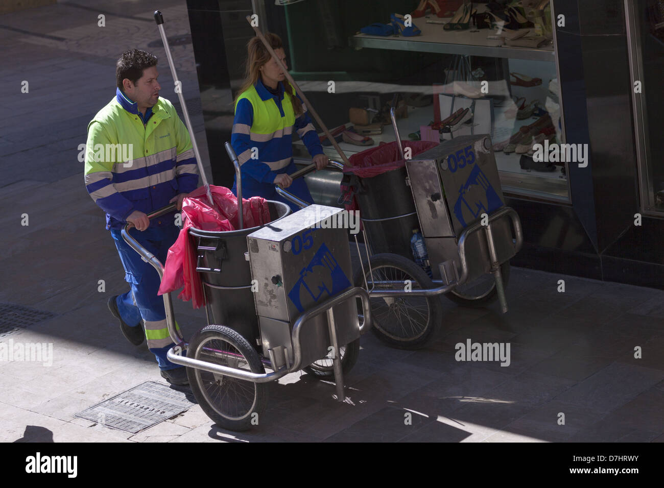 Spanish street cleaners with hand trolleys Stock Photo Alamy