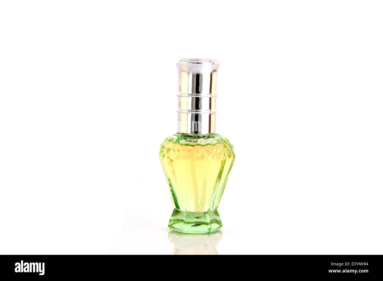 The Green Perfume bottle resting on a white background. Stock Photo