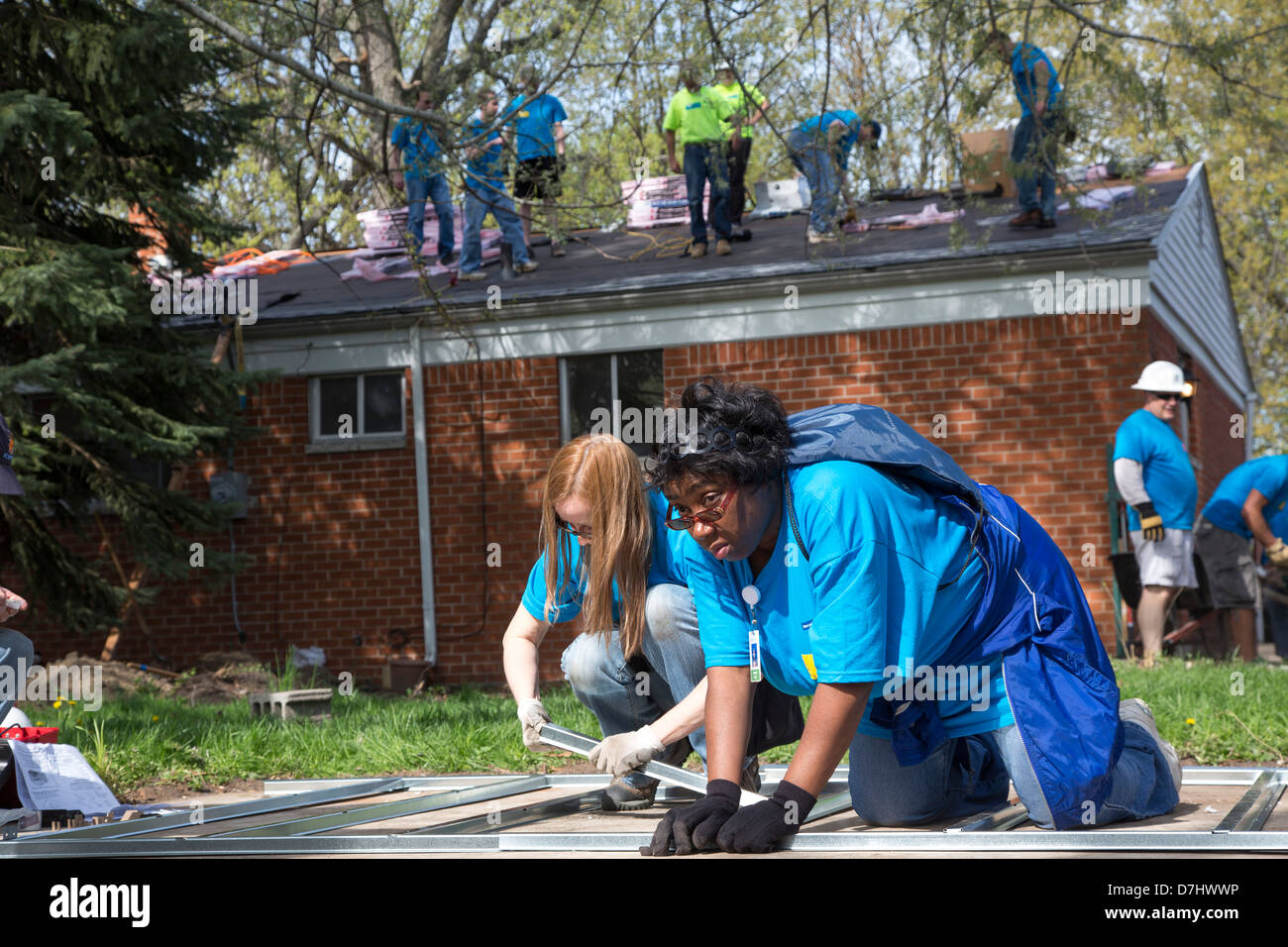 Volunteers Rehabilitate a House for Habitat for Humanity Stock Photo