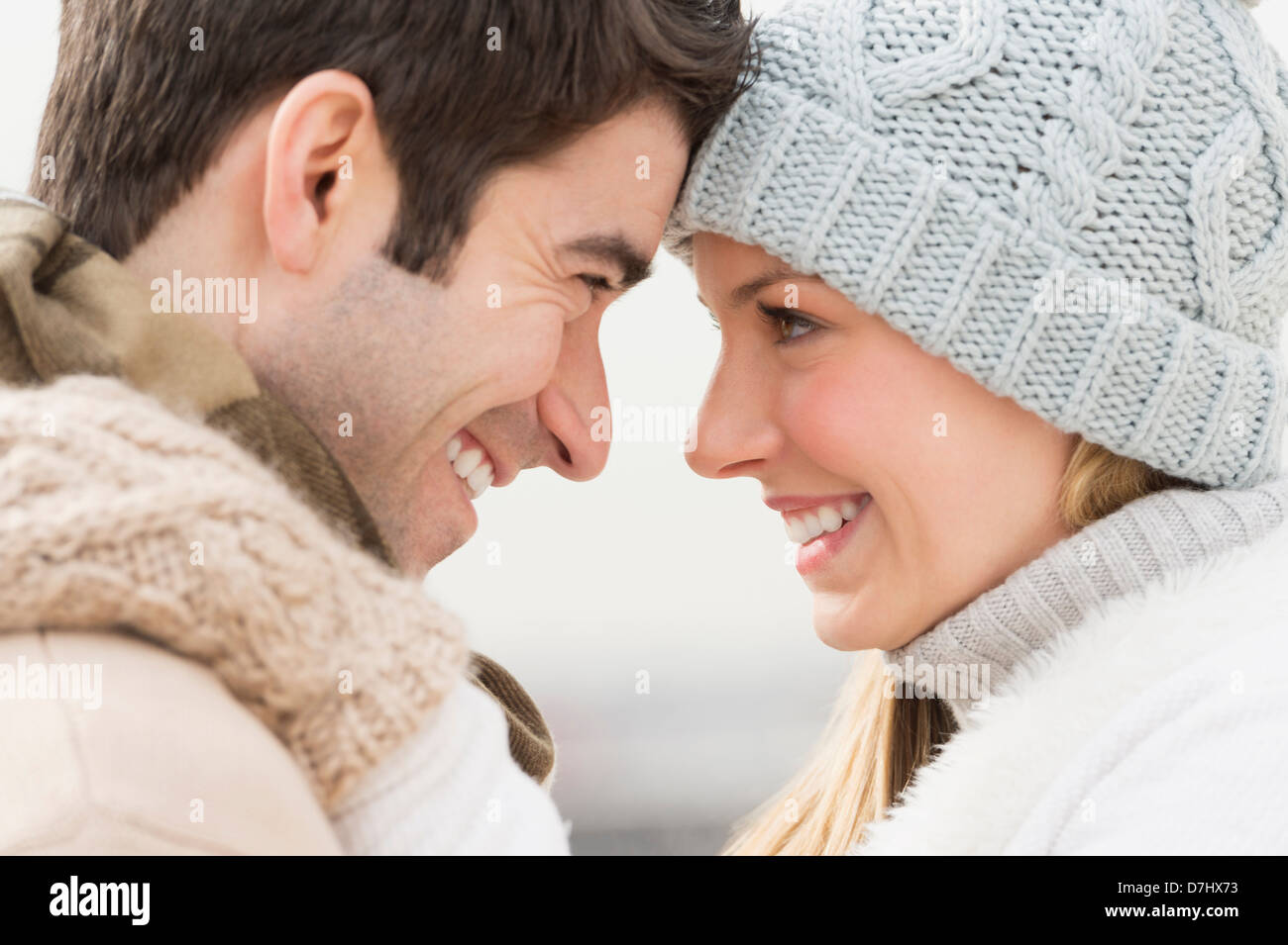 Profile of couple in winter clothing Stock Photo
