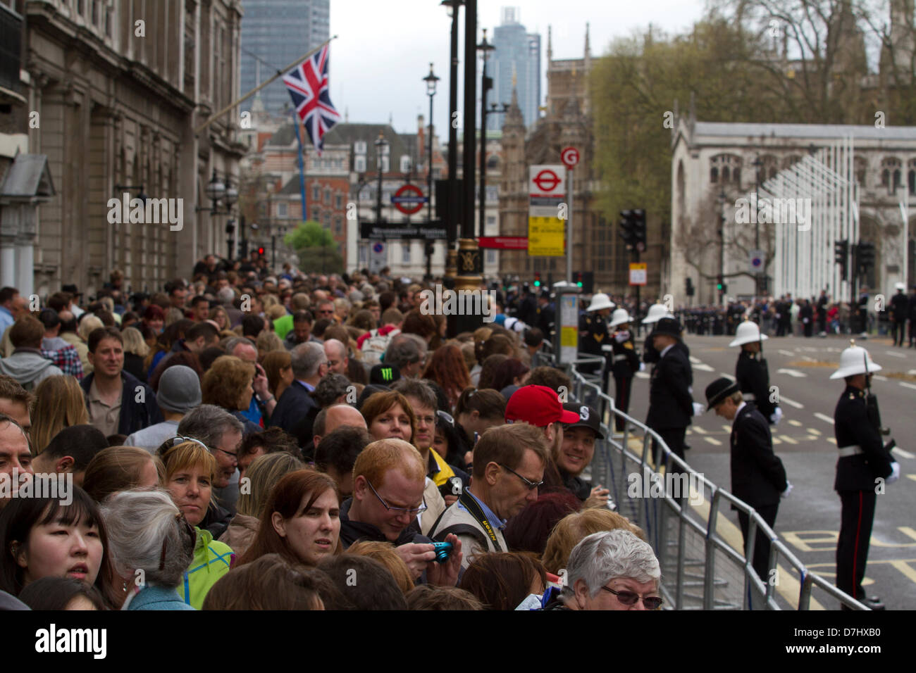 Westminster London, UK. 8th May 2013.  Large crowds gather in Whitehall to see Queen's procession for the opening  of Parliament at the House of Lords.  The Queen will deliver a speech which will set out the government's agenda for 2013/14 with 19 draft bills. Credit: Amer Ghazzal/Alamy Live News Stock Photo