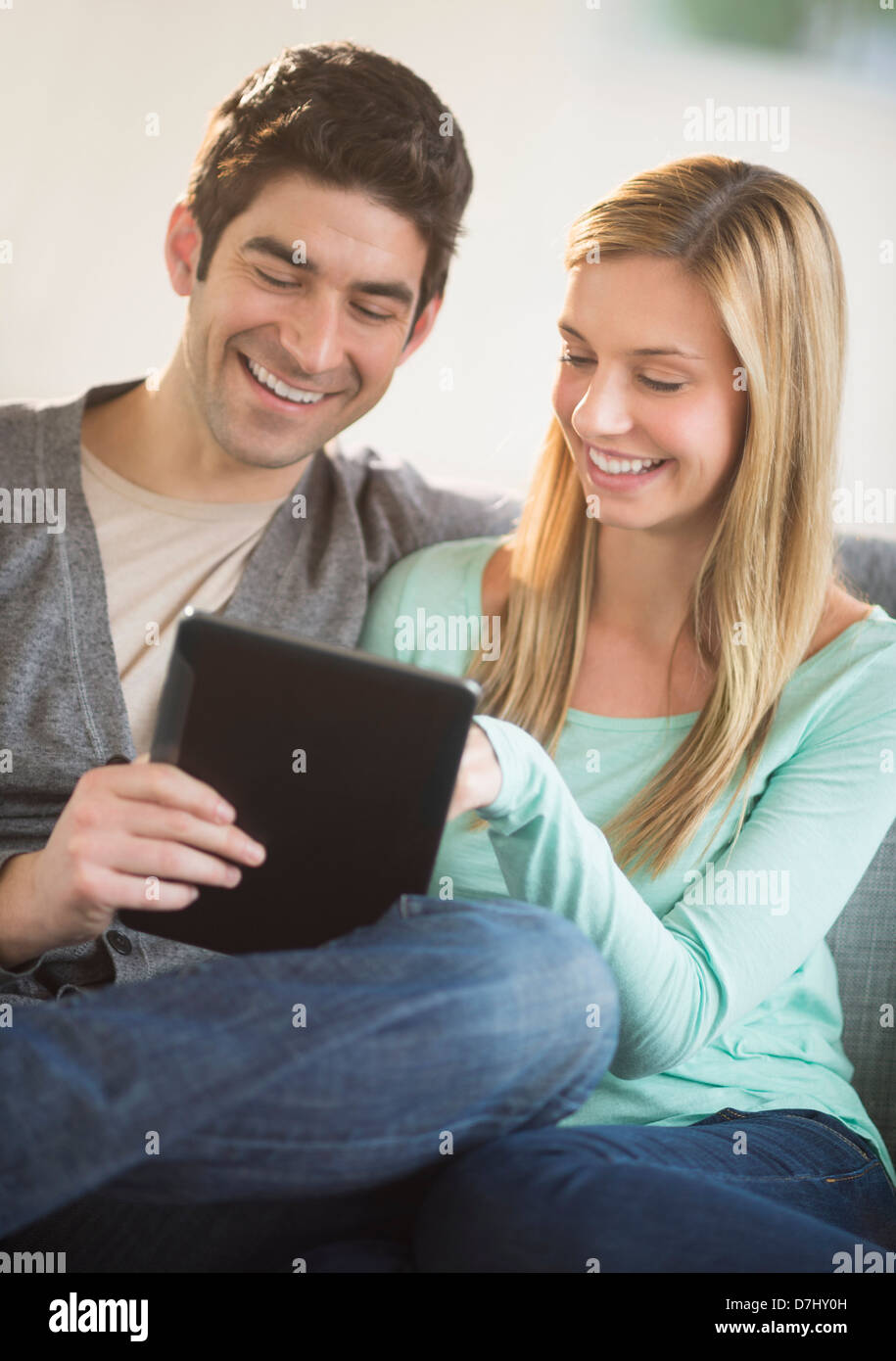 Couple using tablet pc Stock Photo