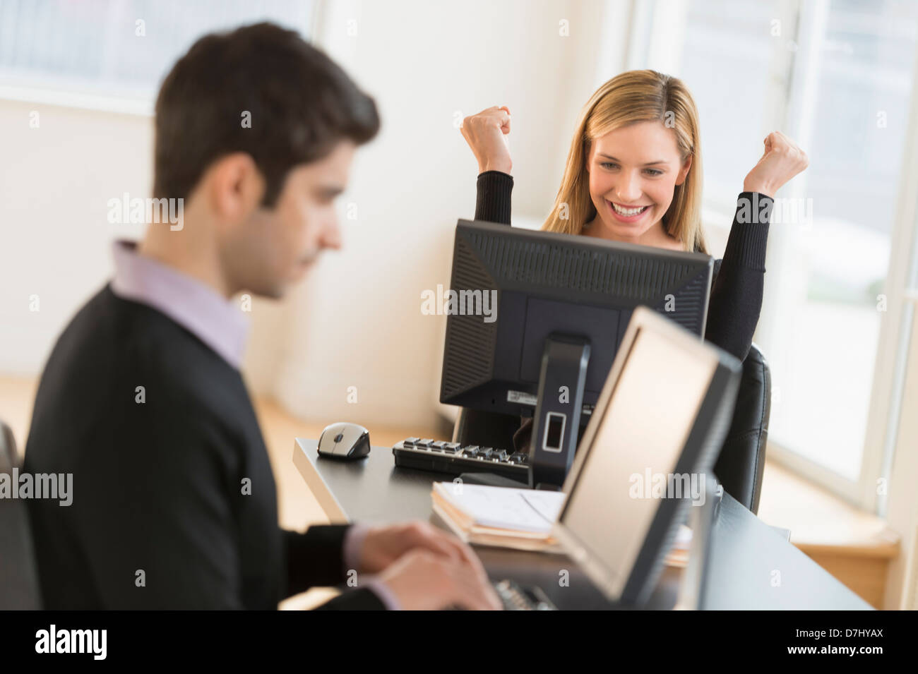 Business man and woman working in office Stock Photo - Alamy