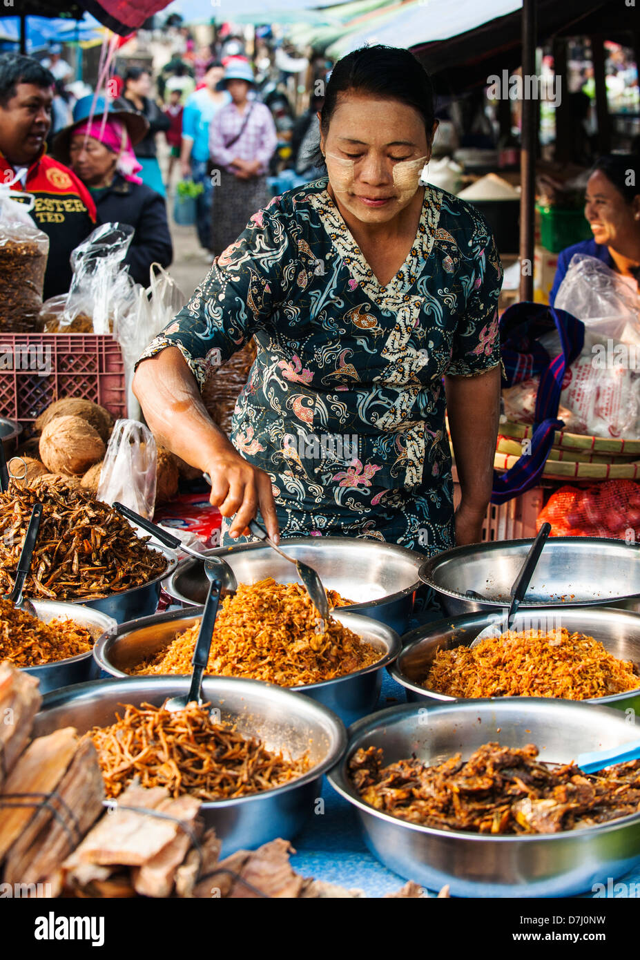 Woman selling dry fish at the Kyaing Tong market, Burma (Myanmar) Stock Photo