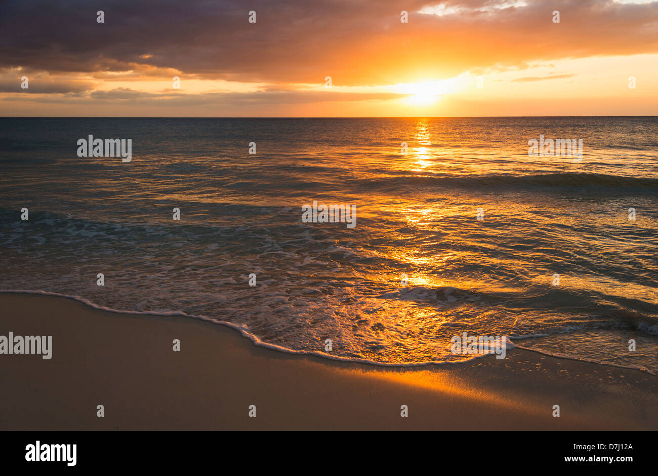 Jamaica, Sun setting over sea Stock Photo