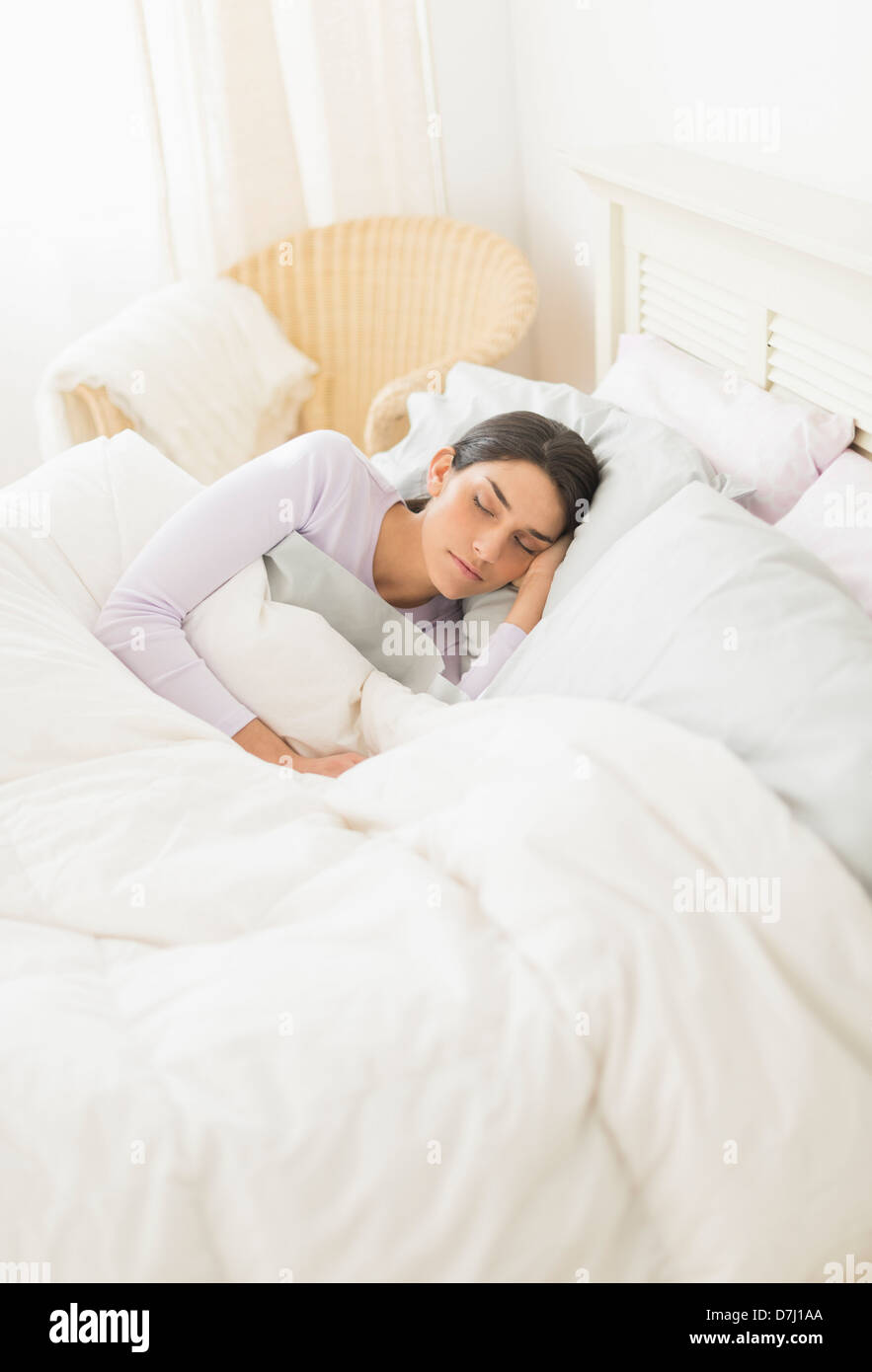 Woman sleeping in bed Stock Photo Alamy