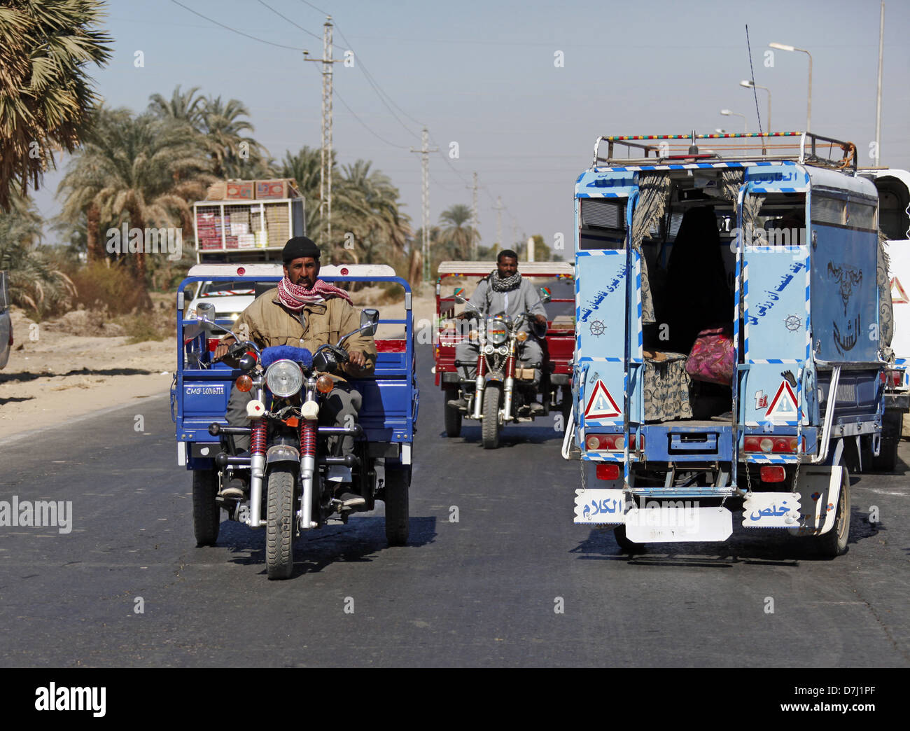 EGYPTIAN TRICYCLE & MINI BUS NEAR ASWAN EGYPT 11 January 2013 Stock Photo