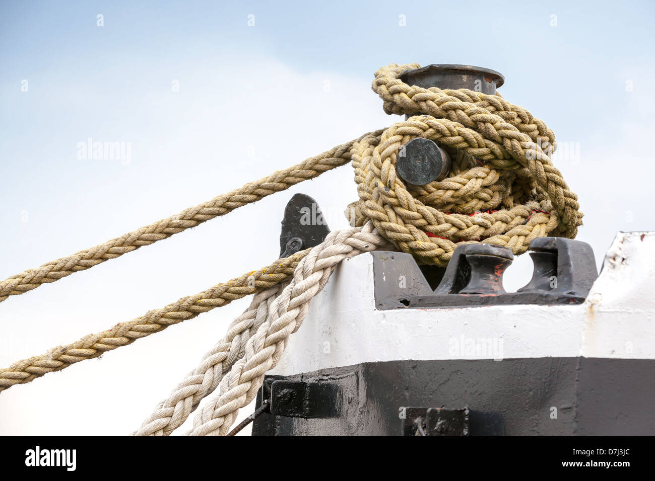 Ships mooring bollard with heavy duty mooring ropes Stock Photo