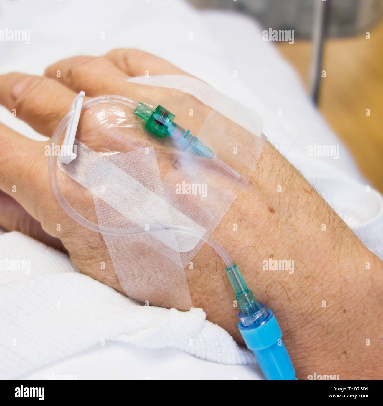 Close up of hand of elderly patient with IV drip attached Stock Photo