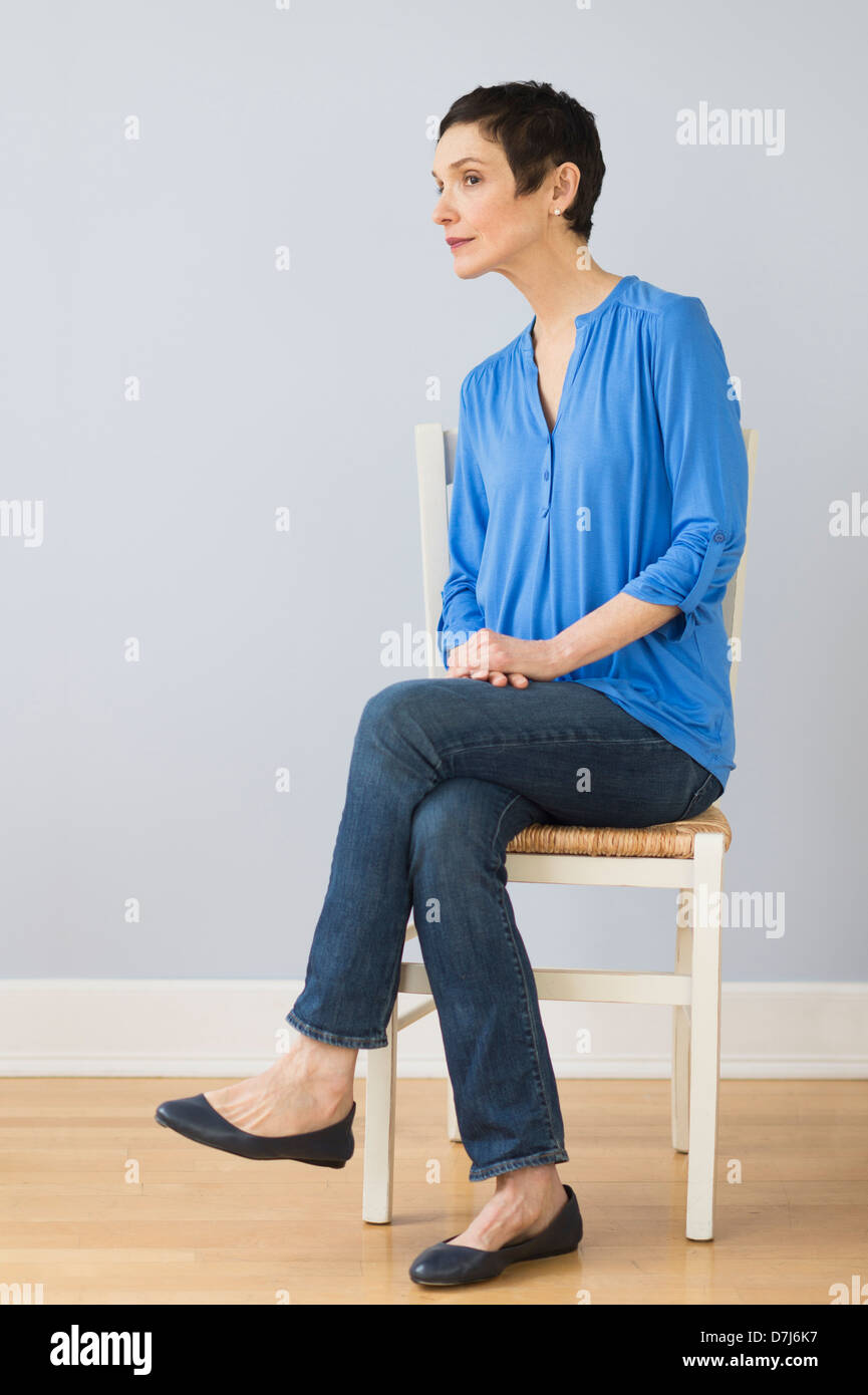 Woman sitting chair full length hi-res stock photography and images - Alamy
