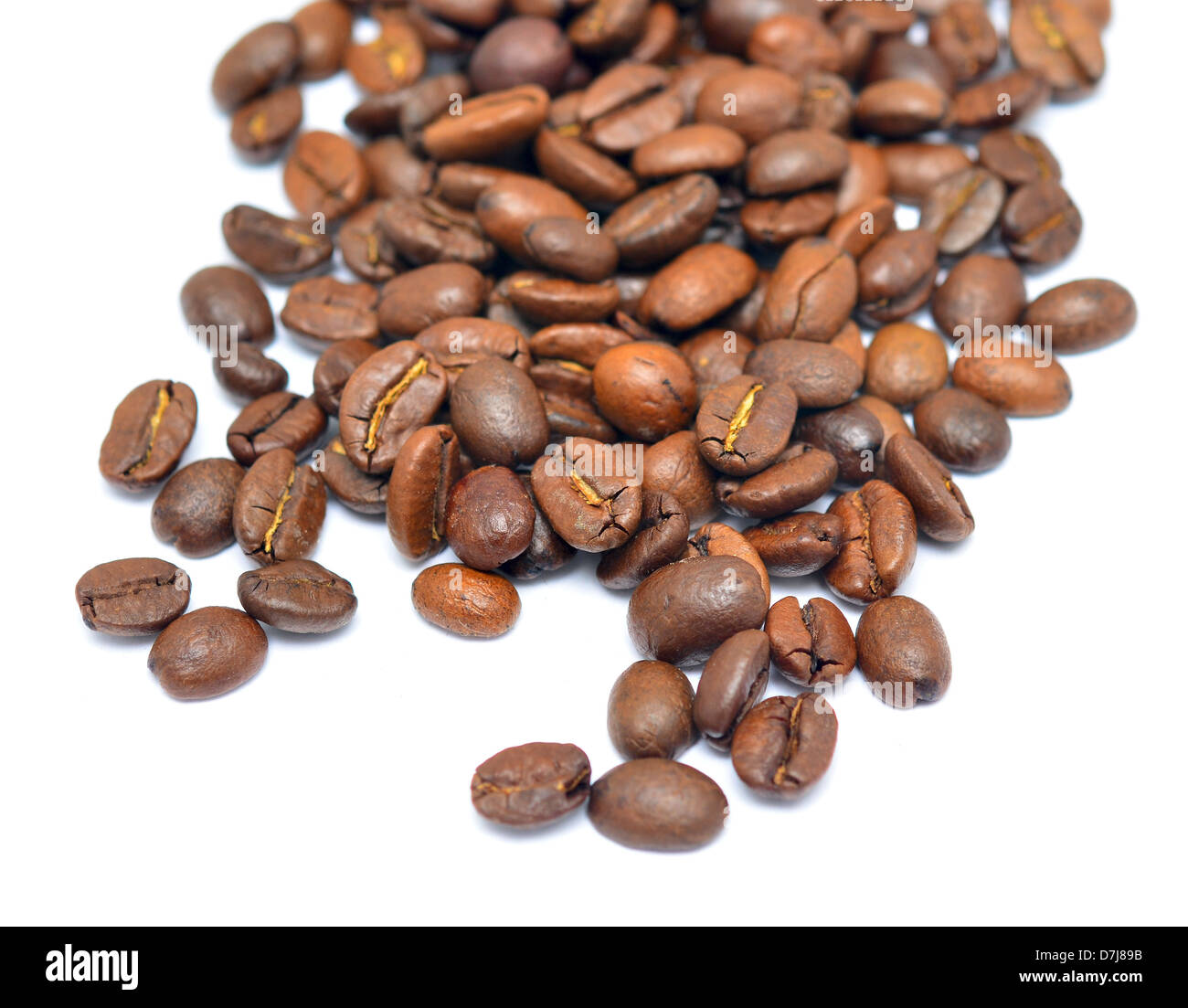 Heap of coffee beans isolated on white background Stock Photo - Alamy