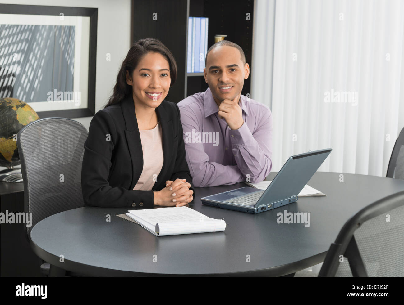 Portrait of man and woman at meeting in office Stock Photo - Alamy