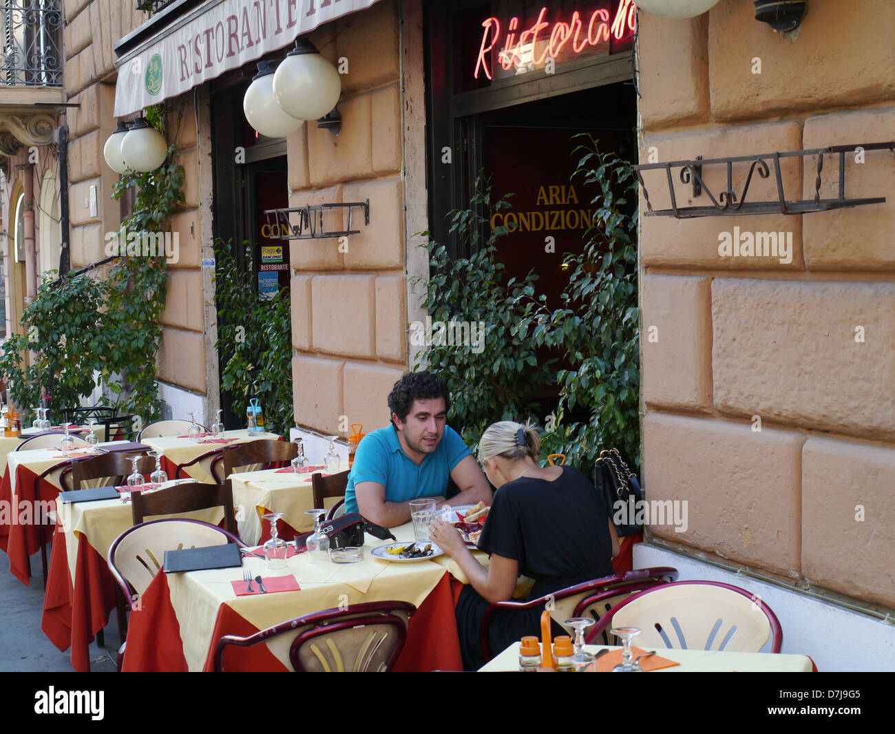 Rome couple sitting at table of outdoor cafe Stock Photo