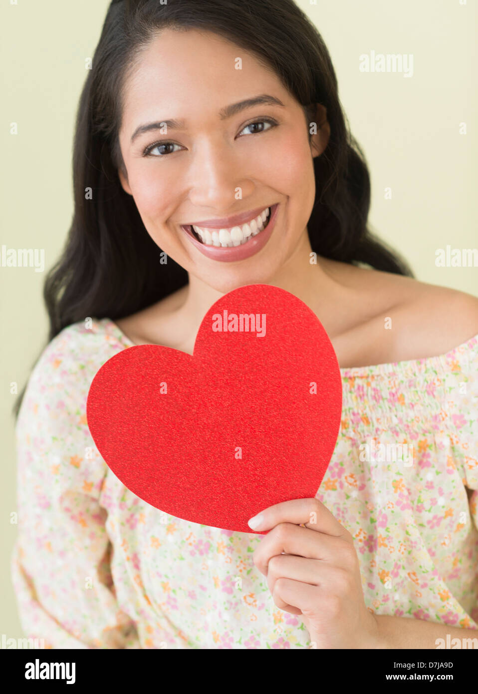Young woman holding red paper heart Stock Photo