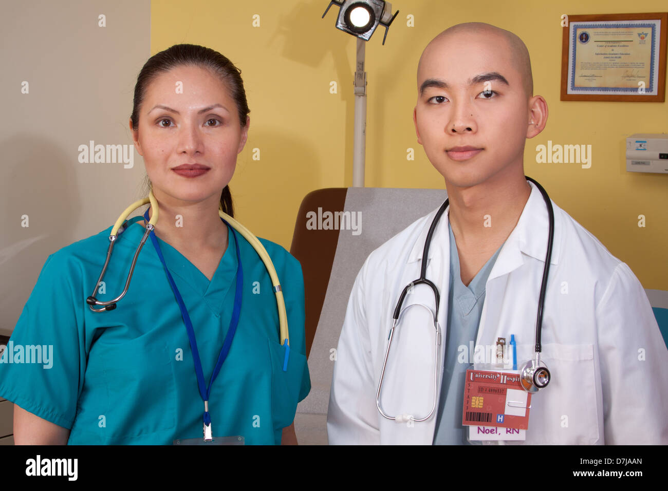 Portrait of two health care professionals, in exam room. Stock Photo