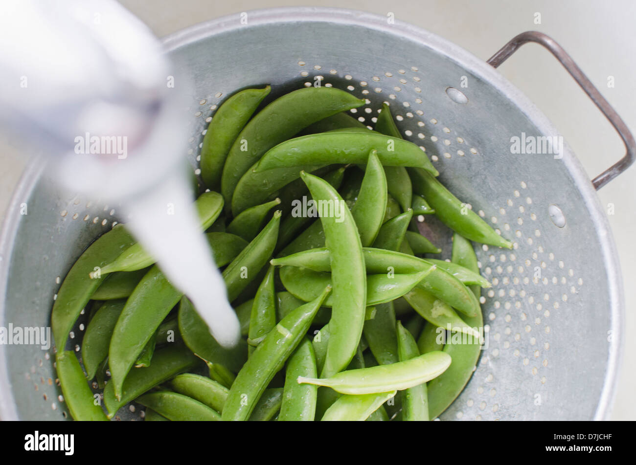 Preparing of green peas Stock Photo