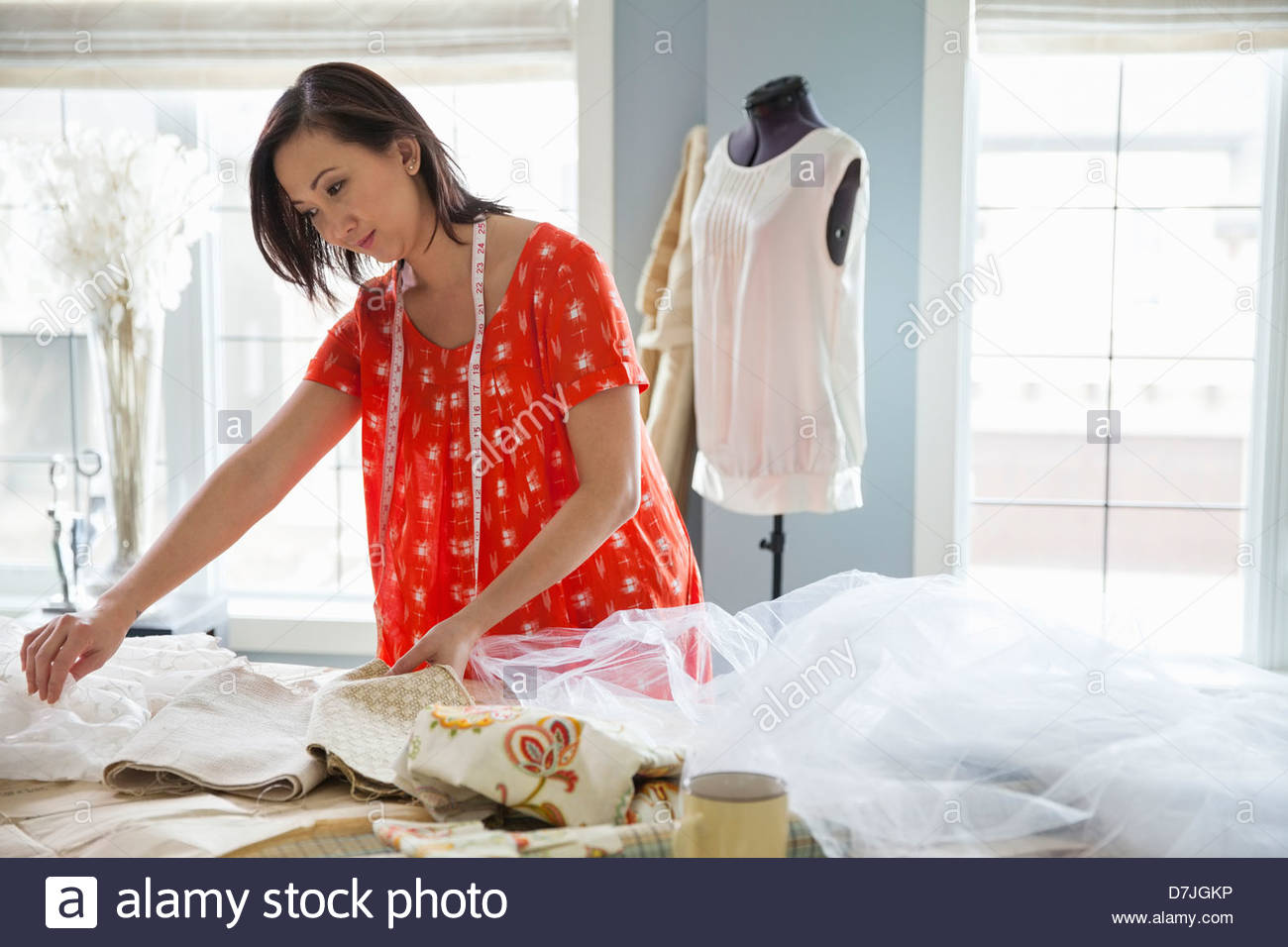 Female seamstress working in home studio Stock Photo