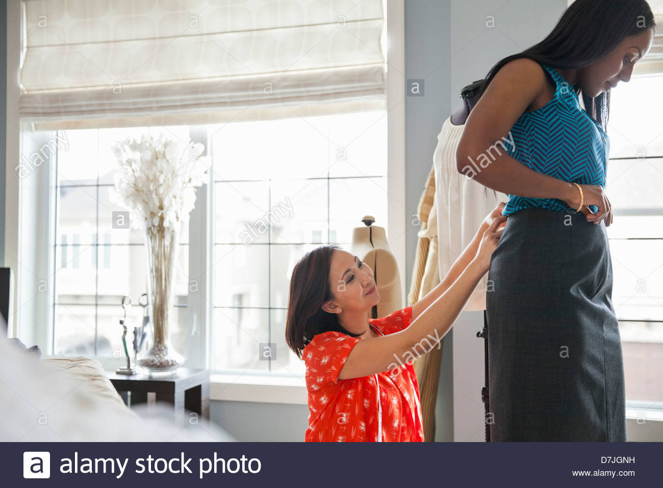 Female seamstress doing alterations in home studio Stock Photo Alamy