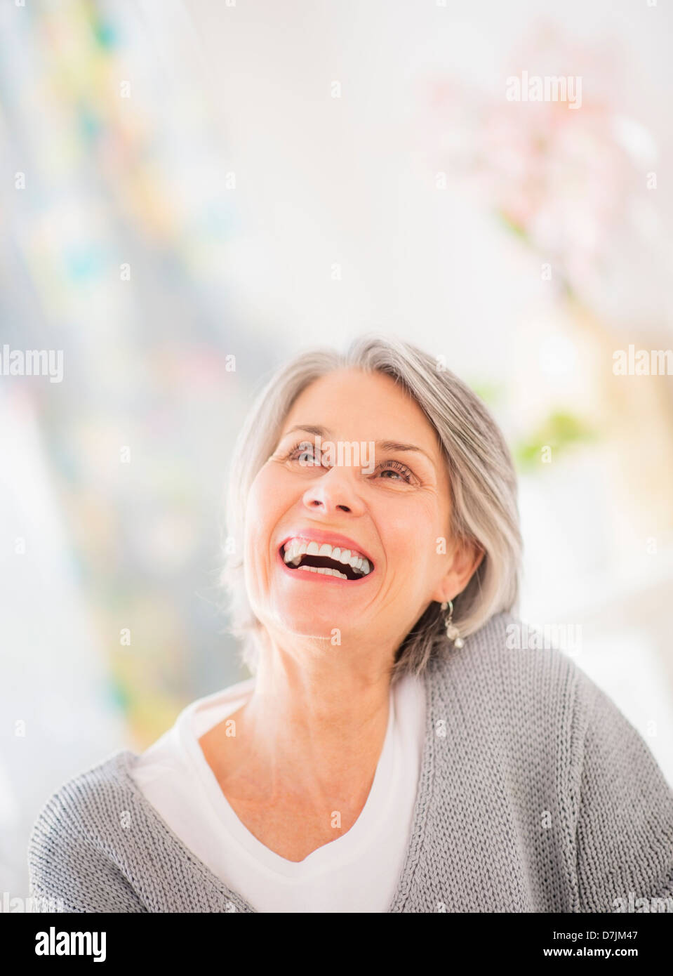 Portrait of woman relaxing on sofa Stock Photo - Alamy