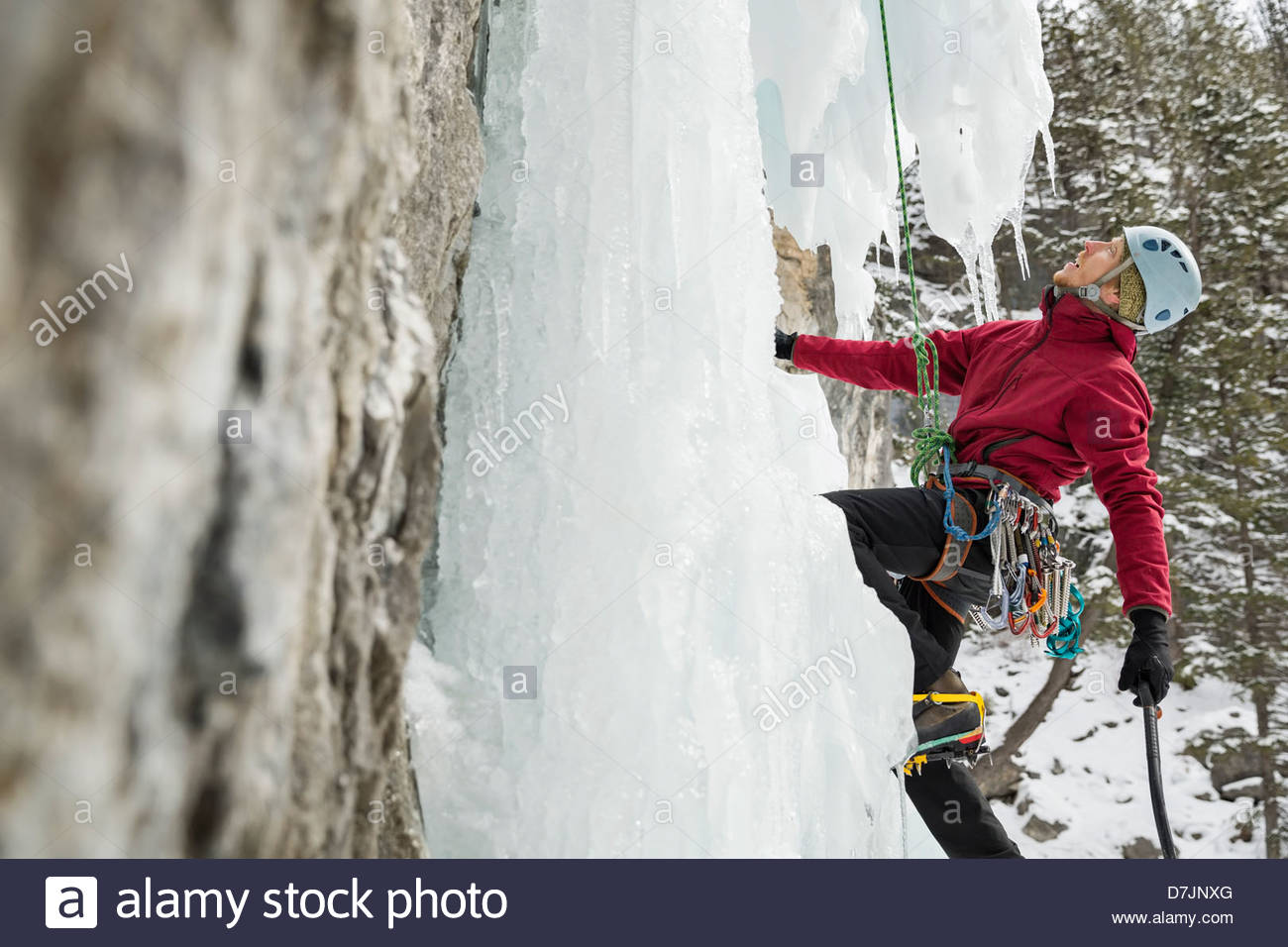 Side view of man climbing wall hi-res stock photography and images - Alamy