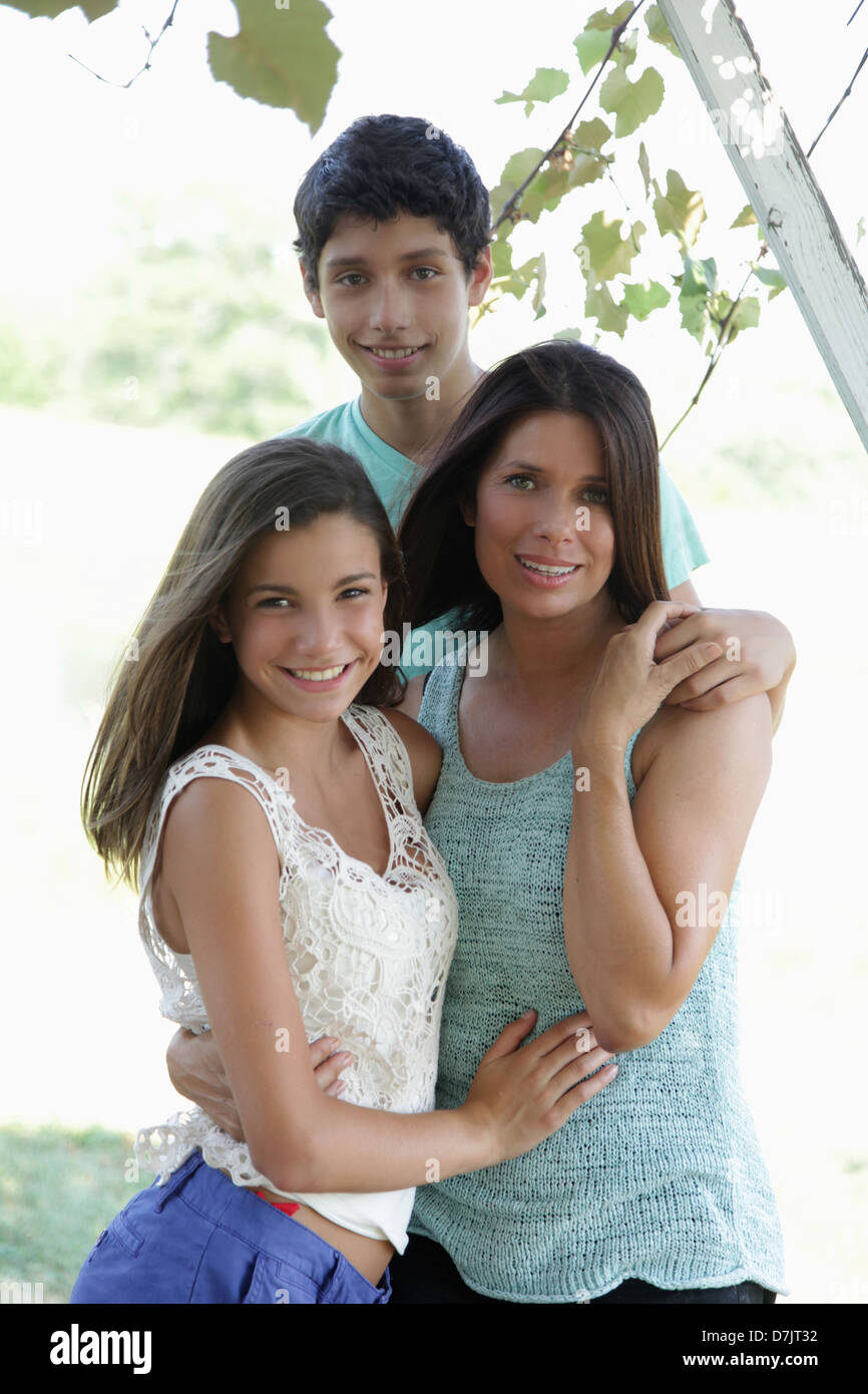 Portrait of mother with daughter (12-13) and son (14-15) Stock Photo
