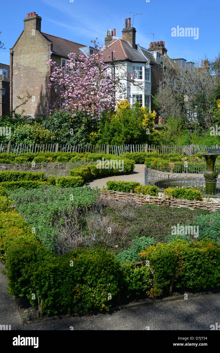 Greenwich Royal Park herb garden with residential gardens beyond South London England UK Stock Photo
