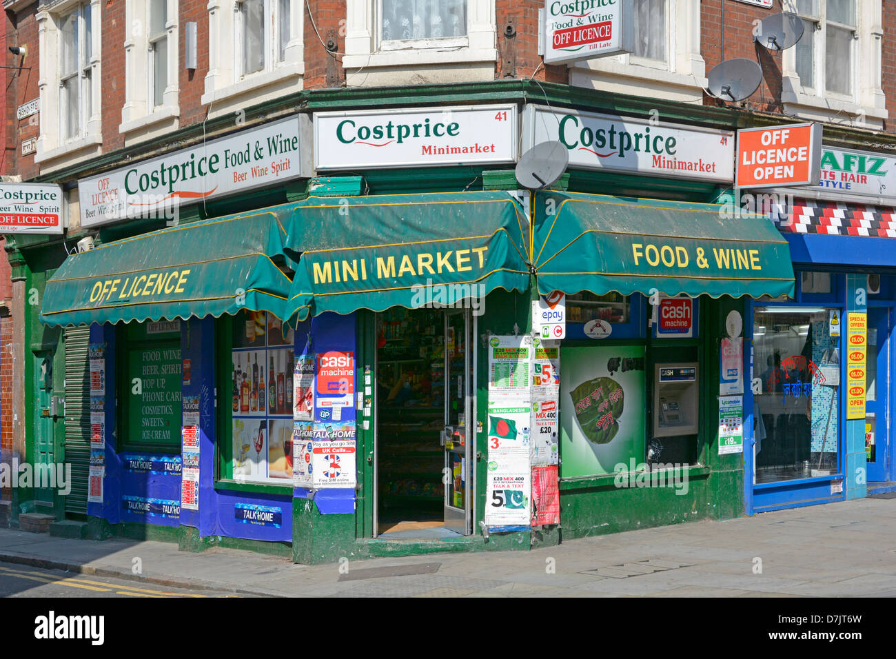 Costprice corner store & Mini Market Off License food & wine convenience store front with canopies in Brick Lane Tower Hamlets East London England UK Stock Photo