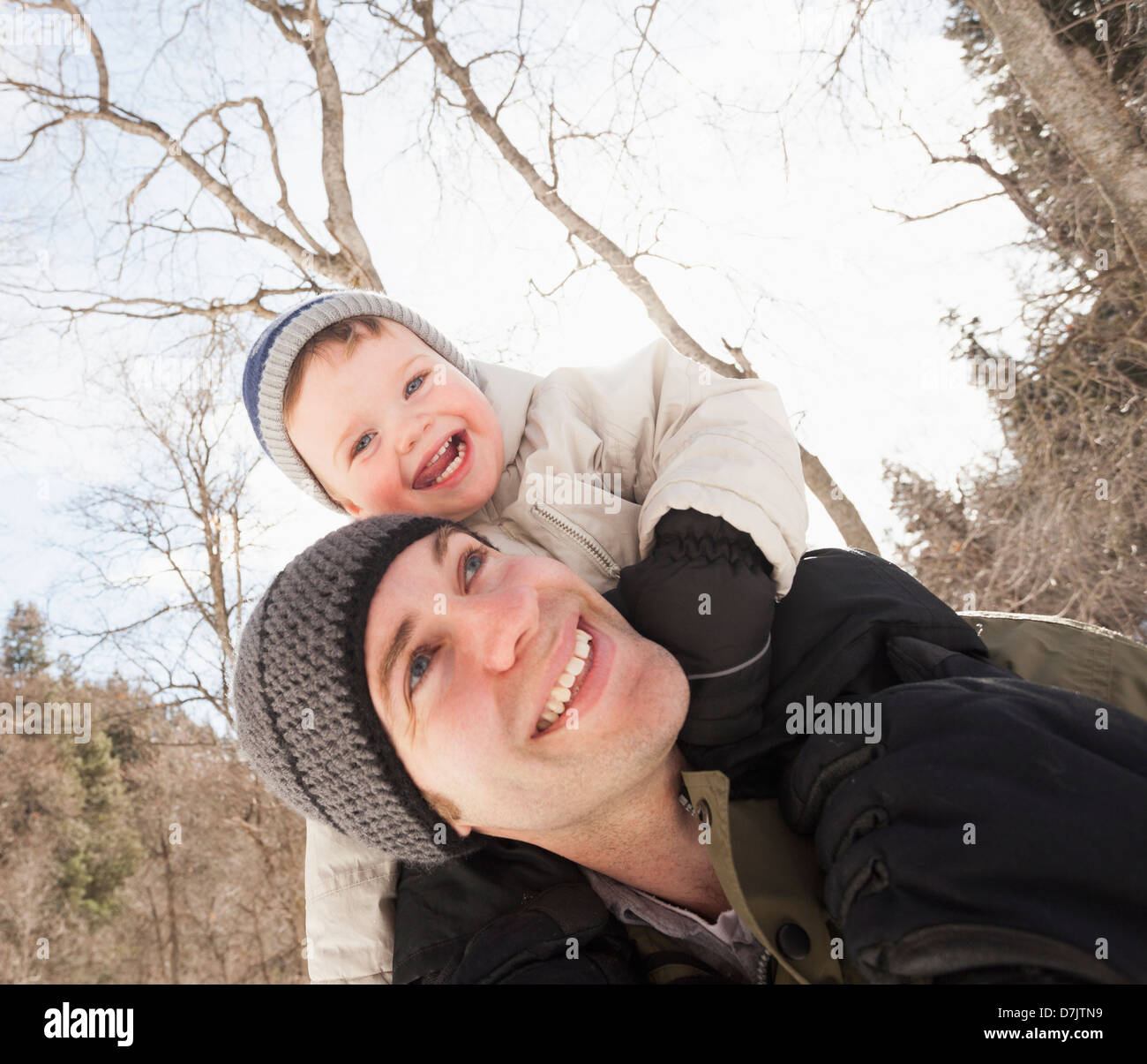 USA, Utah, Highland, Young man carrying his son (12-17 months) on shoulders Stock Photo