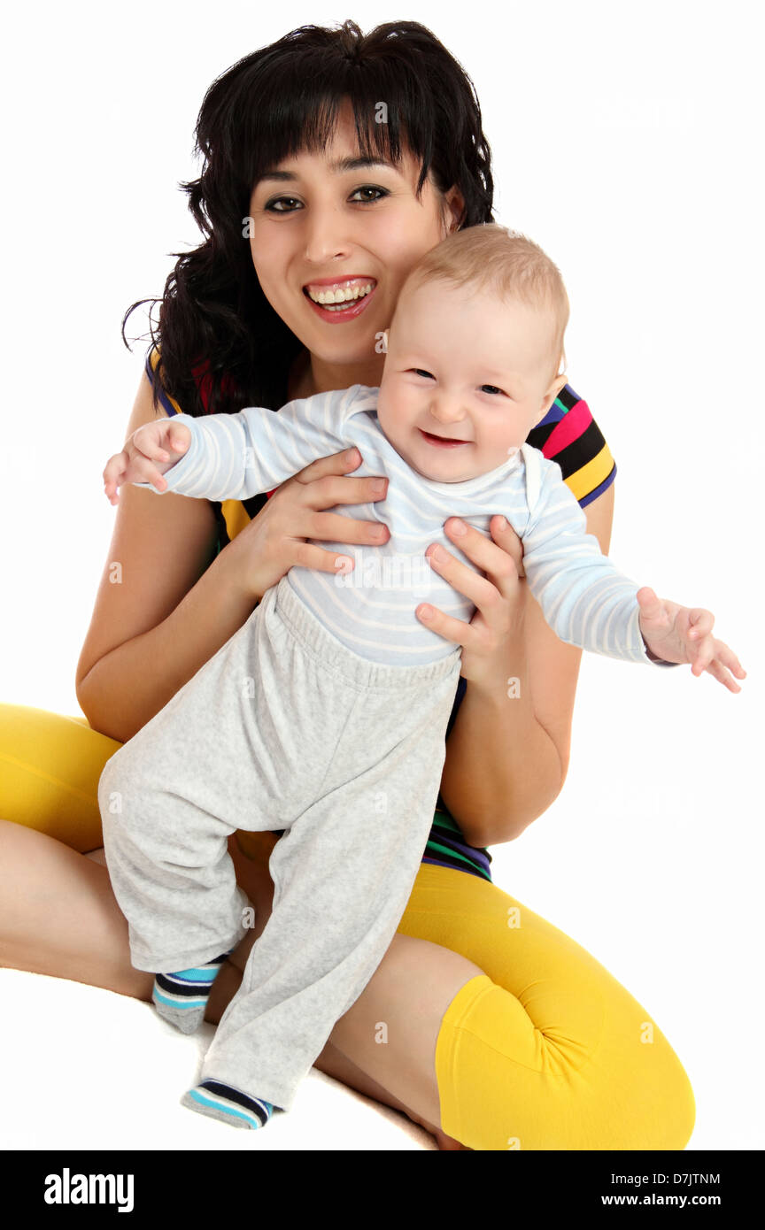 smiling mother and happy baby first steps Stock Photo