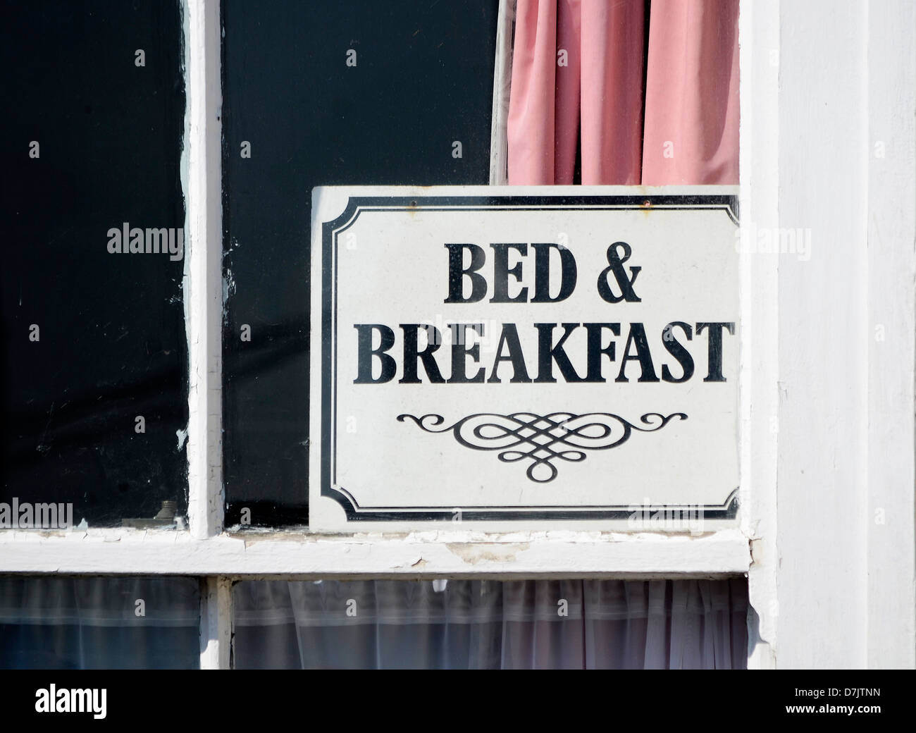 a bed and breakfast in a hotel window, uk Stock Photo Alamy