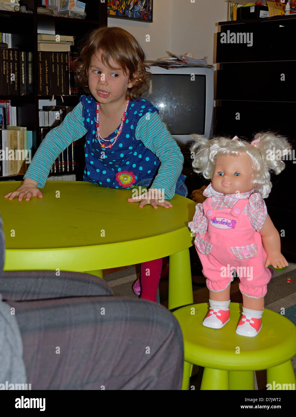 4 year old little girl playing with her doll Stock Photo - Alamy