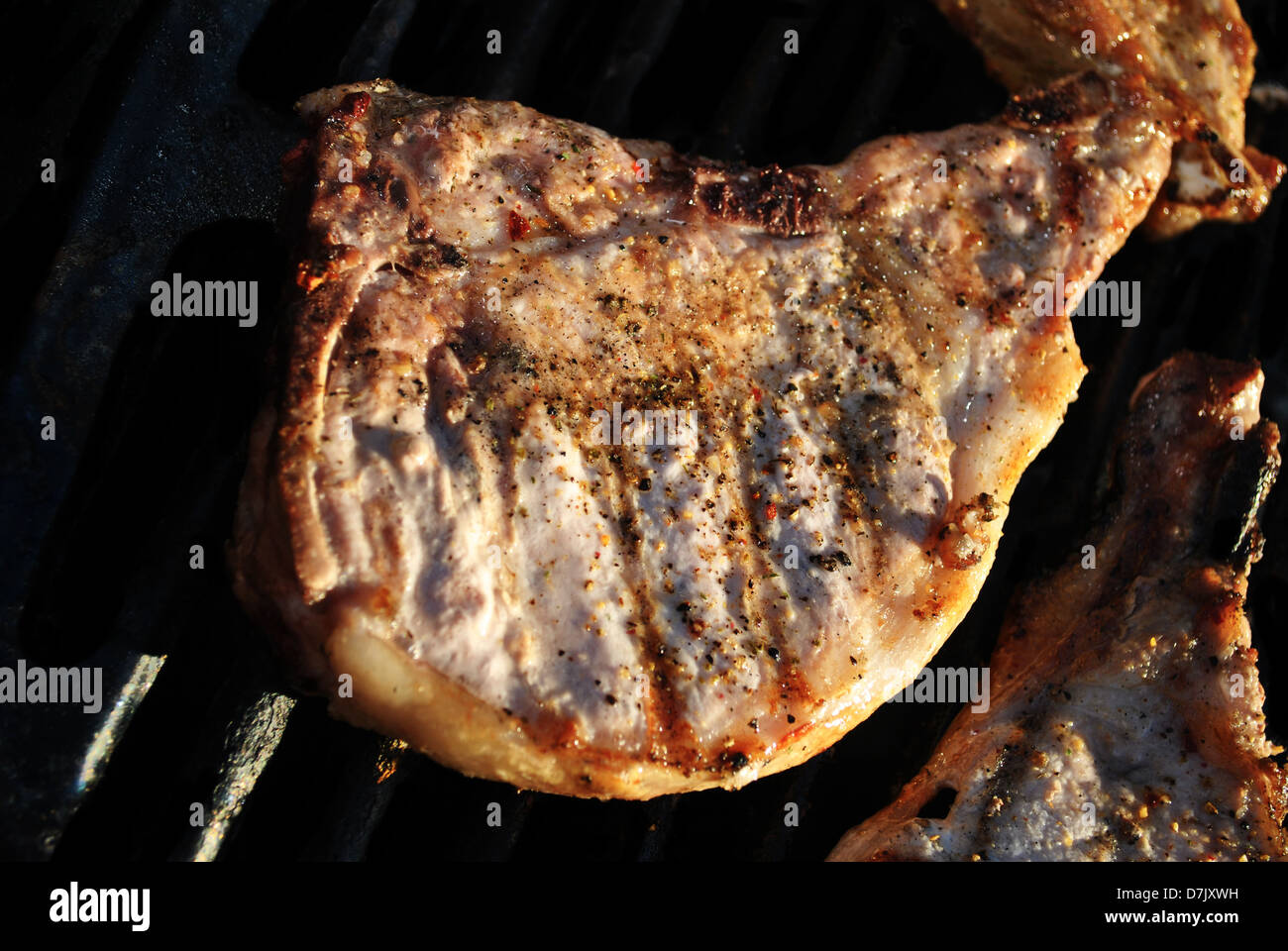 Cooked Thick Pork Chop on the Grill Stock Photo