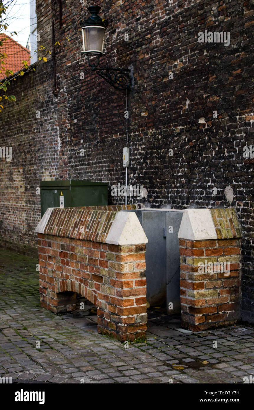 A picture of a urinal on the street of Brugge. Stock Photo
