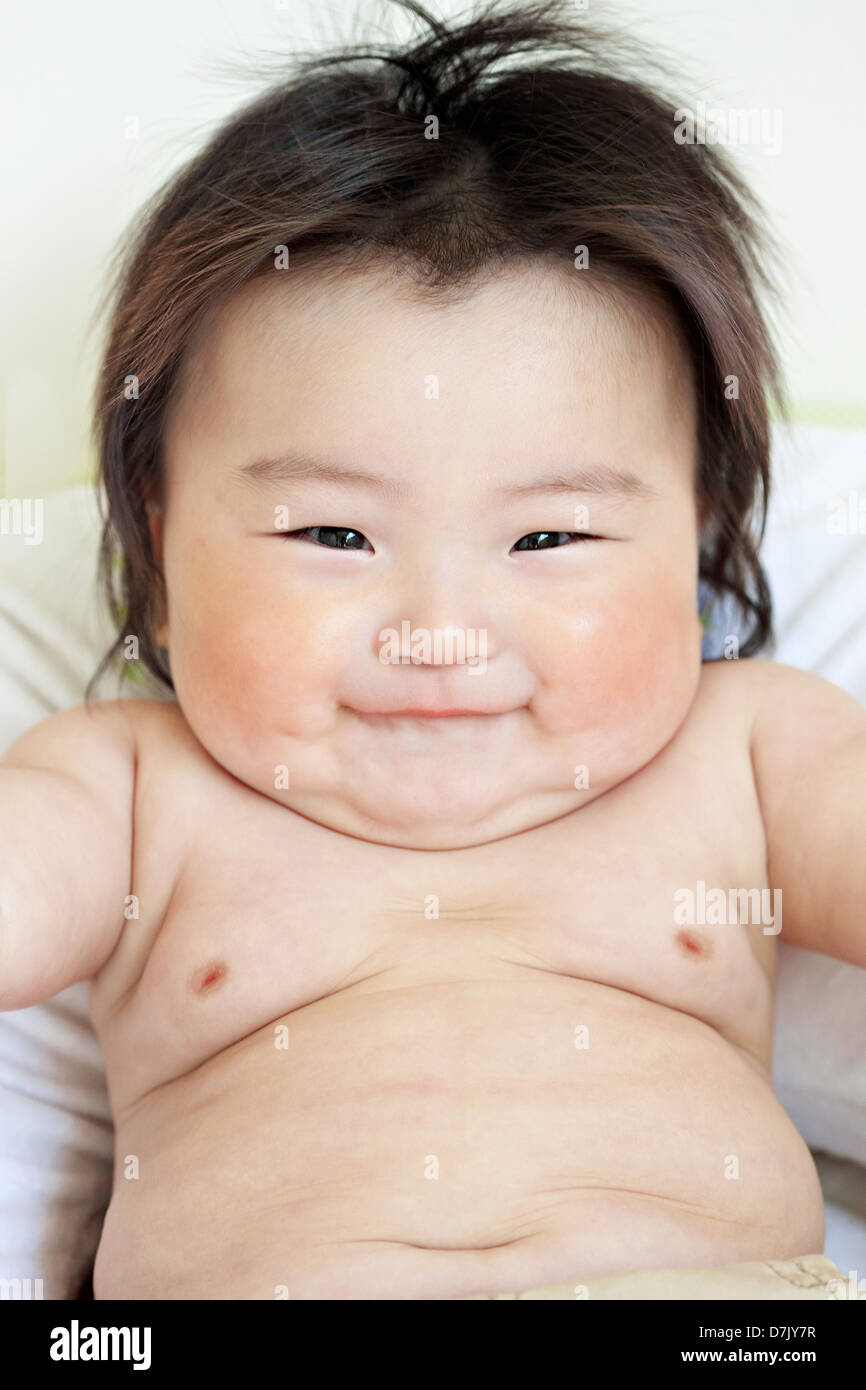 close up portrait of smiling, chubby cute Korean American child Stock Photo